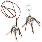 Weathered dreamcatcher necklace — detailed metal pendant.