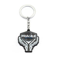 Black metal keychain with FRAGILE lettering — durable accessory.