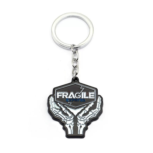 Black metal keychain with FRAGILE lettering — durable accessory.