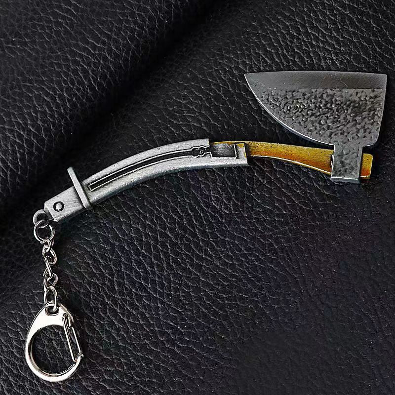 Loaded Axe keychain — black iron mini metal accessory.