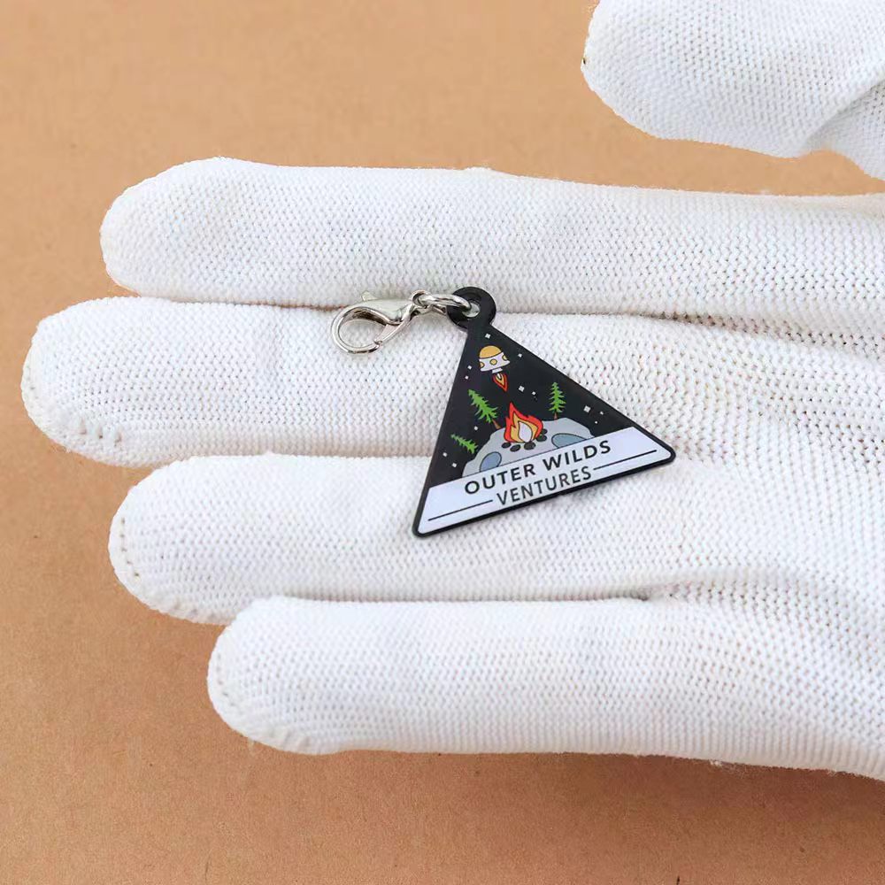 Outer Wilds metal keychain pendant — cosmic adventurer style