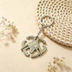 Nomai keychain from Outer Wilds — detailed metal keyring.
